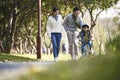 Asian family enjoying outdoor activity in city park Royalty Free Stock Photo