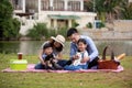 Asian family father mother and kids pinic together with Shiba inu dog Royalty Free Stock Photo