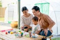 Asian family with father mother and son enjoy to have good activity together to paint eggs relate to easter festival with day