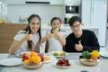 Asian family They are having breakfast together happily in the dining room Royalty Free Stock Photo