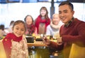 asian family having dinner at restaurant Royalty Free Stock Photo