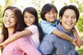 Asian family head and shoulders portrait outdoors Royalty Free Stock Photo