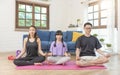 Asian family healthy meditation workout at home, exercise, fit, doing yoga. home sport fitness concept Royalty Free Stock Photo