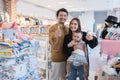 asian family with her toddler boy shopping in the baby shop with thumb up Royalty Free Stock Photo