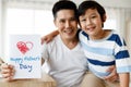 Asian family I love you, dad! Handsome man at home with his little boy. Happy Father`s Day. Concept Greeting card Royalty Free Stock Photo