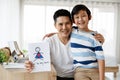 Asian family I love you, dad! Handsome man at home with his little boy. Happy Father`s Day. Concept Greeting card Royalty Free Stock Photo