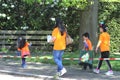 Integrated Asian family in orange t-shirts at Kingsday (Koningsdag), Netherlands