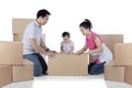 Asian family is packing cardboard on studio Royalty Free Stock Photo