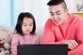 Asian family playing on computer Royalty Free Stock Photo