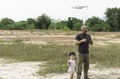 Asian family playing drone at the public park