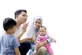 Asian family playing with soap bubbles on studio Royalty Free Stock Photo