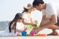 Asian Family playing together at beach with kids happy vacation travel beach concept. Royalty Free Stock Photo