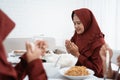 Asian family pray when breaking fast Royalty Free Stock Photo