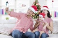 Asian family with Santa hat and smartphone Royalty Free Stock Photo