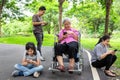 Asian family,senior grandmother,father,mother,daughter with internet,mobile phone addict,child girl playing video game,parent