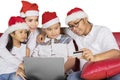 Asian family shopping online at Christmas time Royalty Free Stock Photo