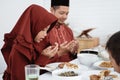 Asian family pray when breaking fast Royalty Free Stock Photo
