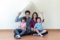 Asian family sit togather in new house with home icon concept Royalty Free Stock Photo