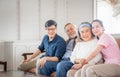 Asian family sitting in living room, Senior father mother and middle aged son and daughter, Happiness family concepts Royalty Free Stock Photo