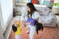 Asian family smiling and happy. Child pilot dreams of traveling, mother and daughter play together