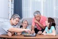 Asian family, spend time on vacation Do activities together By playing chess games