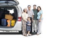 Asian family standing near a car on studio