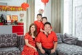 Asian family with two son holding ang pao smiling looking at camera Royalty Free Stock Photo