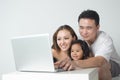 Asian Family Using the Laptop