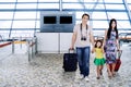 Asian family walking together on the airport Royalty Free Stock Photo