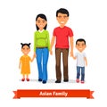 Asian family walking together and holding hands