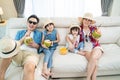 Asian Family watch TV screen, pretend on beach during summer in house. Happy Traveller people having fun stay at home, Parent Royalty Free Stock Photo