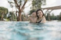 Asian Family, Young Boy Son and 40s Women Mother Having a Good Time Playing and Enjoying in Swimming Pool Royalty Free Stock Photo