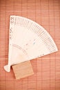 Asian Fan on Bamboo Mat Royalty Free Stock Photo