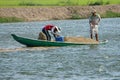 Asian farmer feeding, fish pond, fishery