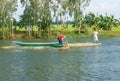 Asian farmer feeding, fish pond, fishery