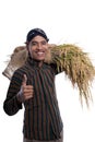 Asian farmer with lurik showing thumb up