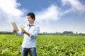Asian farmer with tablet pc Royalty Free Stock Photo