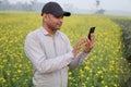 Asian farmer using smartphone