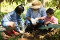 Asian farmers are teaching their children to care for the plants with patience and effort. Royalty Free Stock Photo