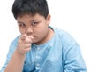 Asian fat boy feeling suspicious and pointing Royalty Free Stock Photo