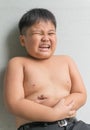 Asian fat boy have stomachache Royalty Free Stock Photo