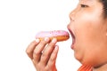 Asian fat boy holds a strawberry-coated donut Royalty Free Stock Photo