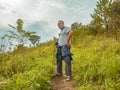 Asian Fat traveler trekking on Khao Luang mountain in Ramkhamhaeng National Park