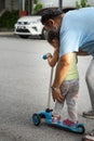 Asian father and daughter walking  and playing on the road at the day time. People having fun outdoors. Concept of friendly family Royalty Free Stock Photo