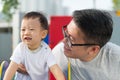 Asian father with his little boy at playground Royalty Free Stock Photo