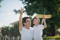 Asian father and son playing cardboard airplane together Royalty Free Stock Photo