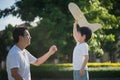 Asian father and son playing cardboard airplane together Royalty Free Stock Photo