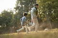 Asian family enjoying outdoor activity in city park Royalty Free Stock Photo