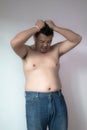 Asian fatman with big belly in worry action