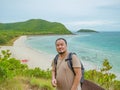 Asian fatty man stand on top of the island